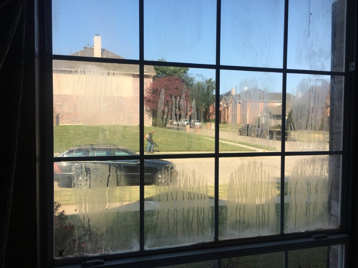 Foggy window with condensation trapped between the glass panes